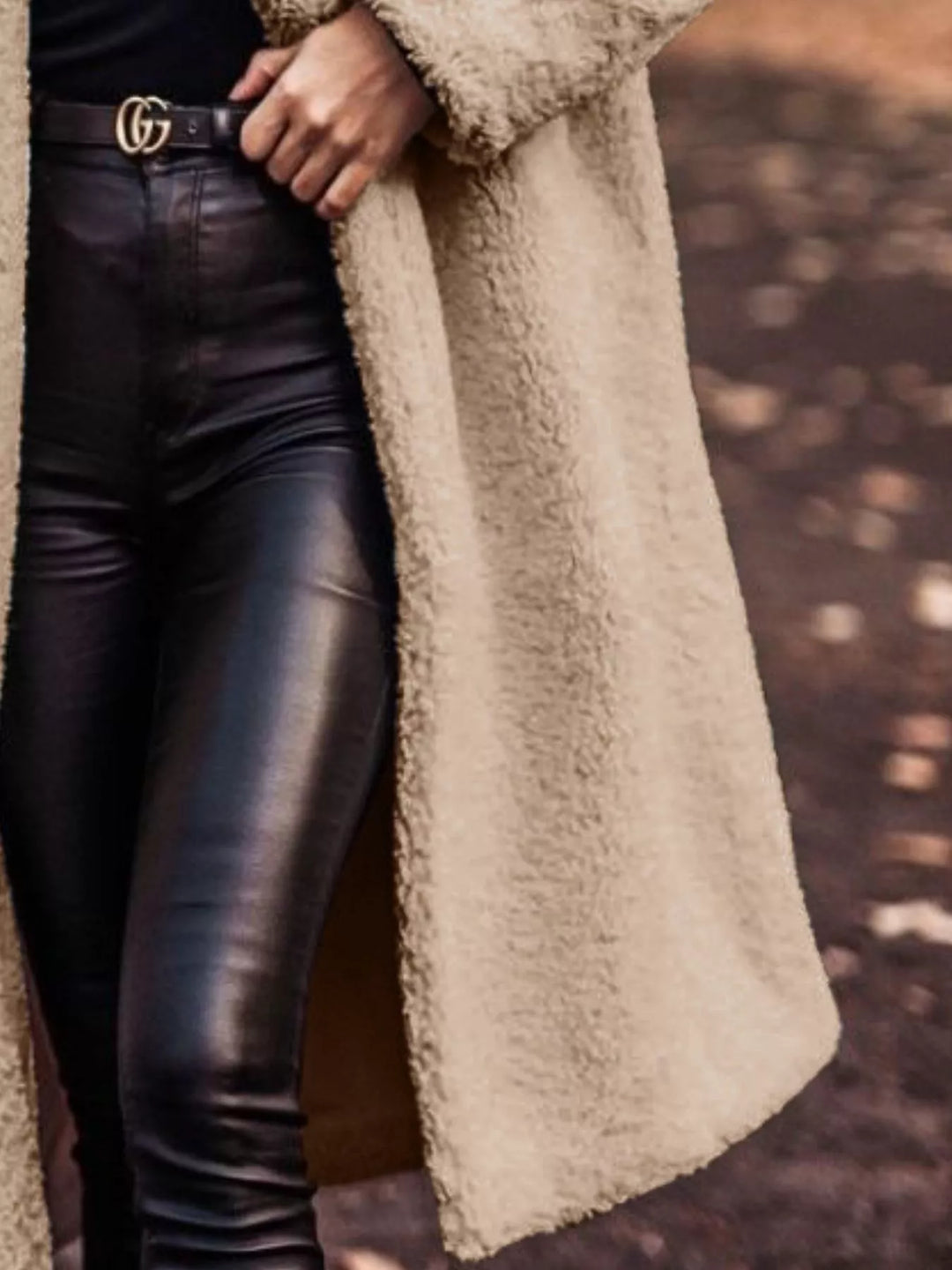 Beige longline open front coat showing the pocket and skirt length