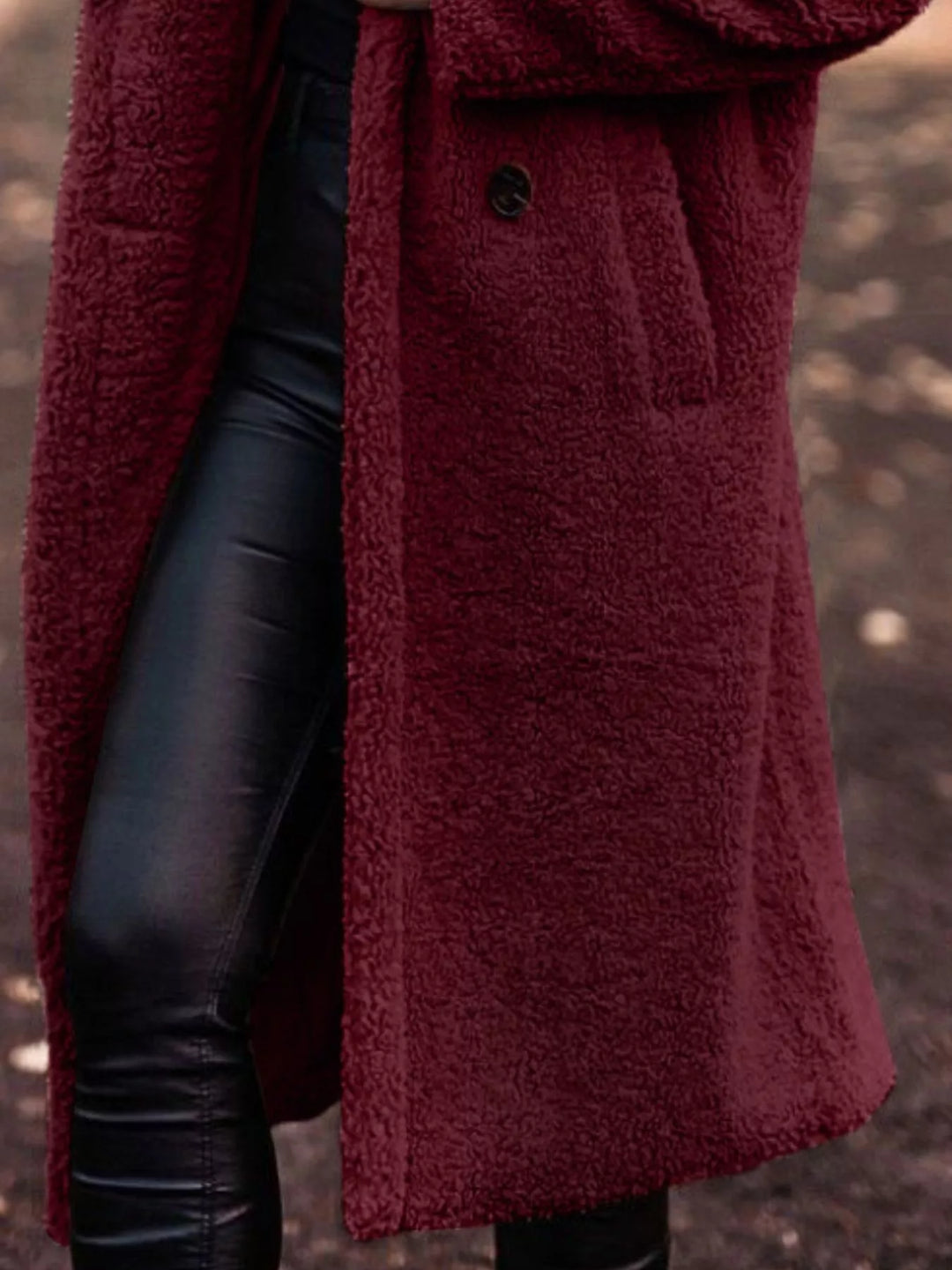 Burgundy longline open front coat showing the pocket and skirt length