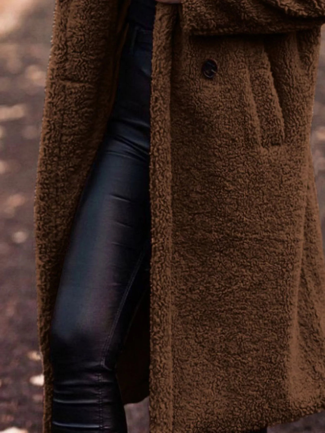 Chocolate longline open front coat showing the pocket and skirt length