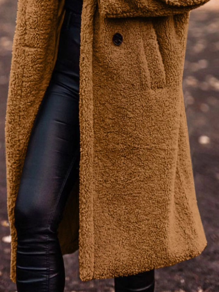 Cognac longline open front coat showing the pocket and skirt length