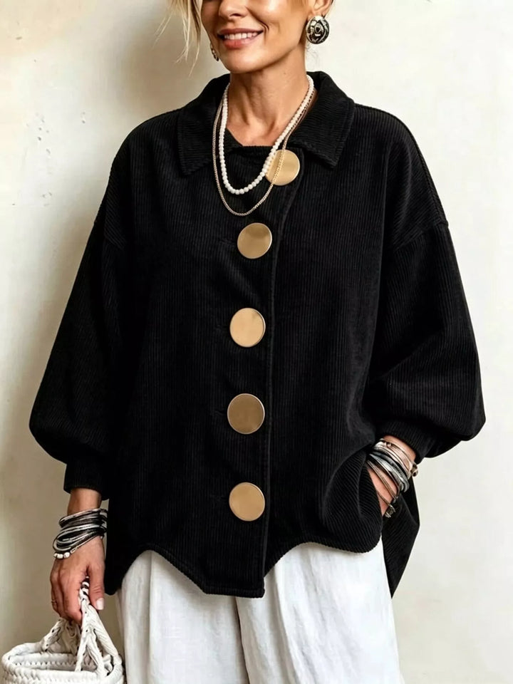 Corduroy-look scalloped hem round buttons in black, front view