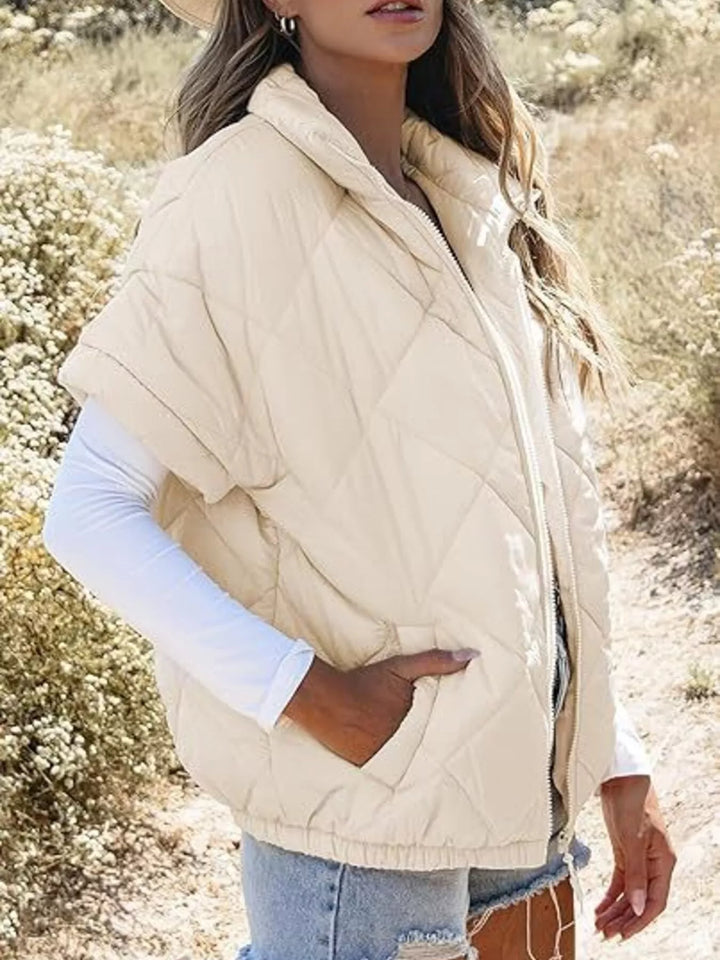 Diamond quilted short sleeve zip in apricot, styled on model