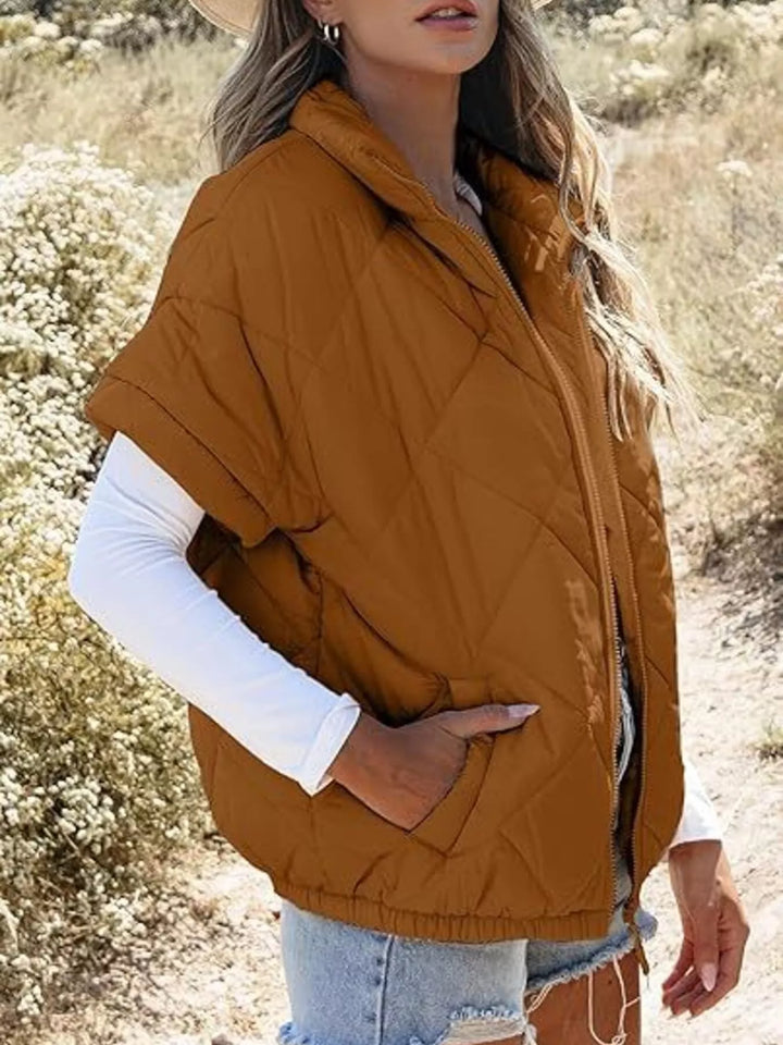 Diamond quilted short sleeve zip in caramel, styled on model