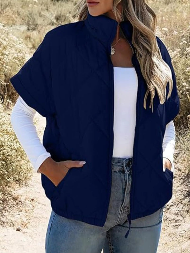 Diamond quilted short sleeve zip in navy blue, front view