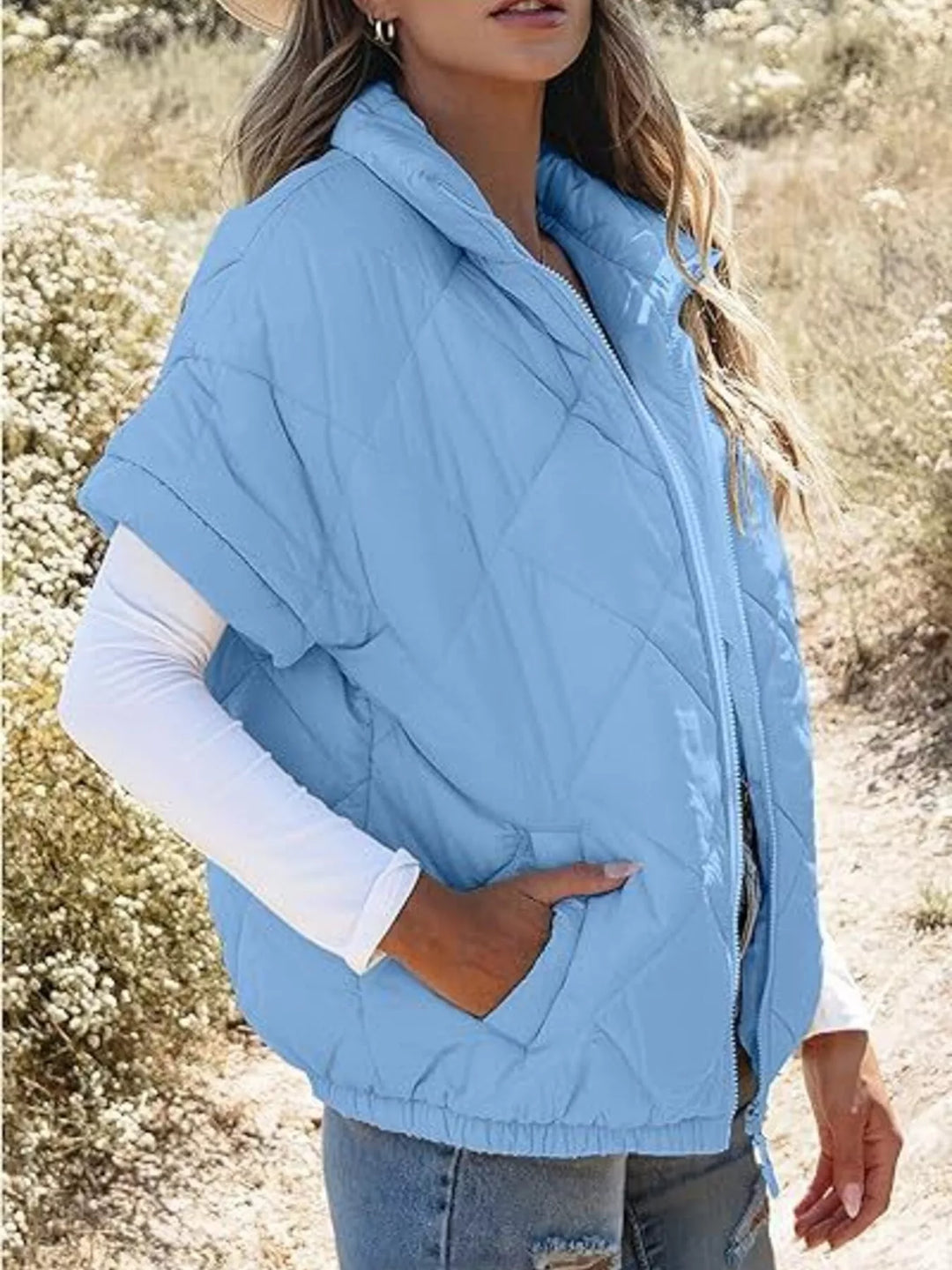 Diamond quilted short sleeve zip in sky blue, styled on model