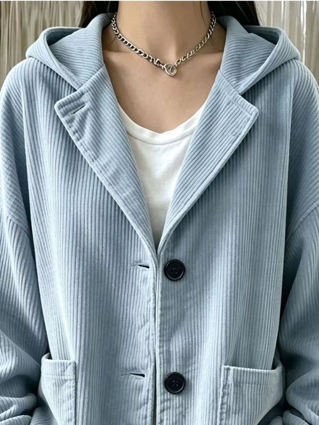 Hooded corduroy-look button front in light blue, styled on model